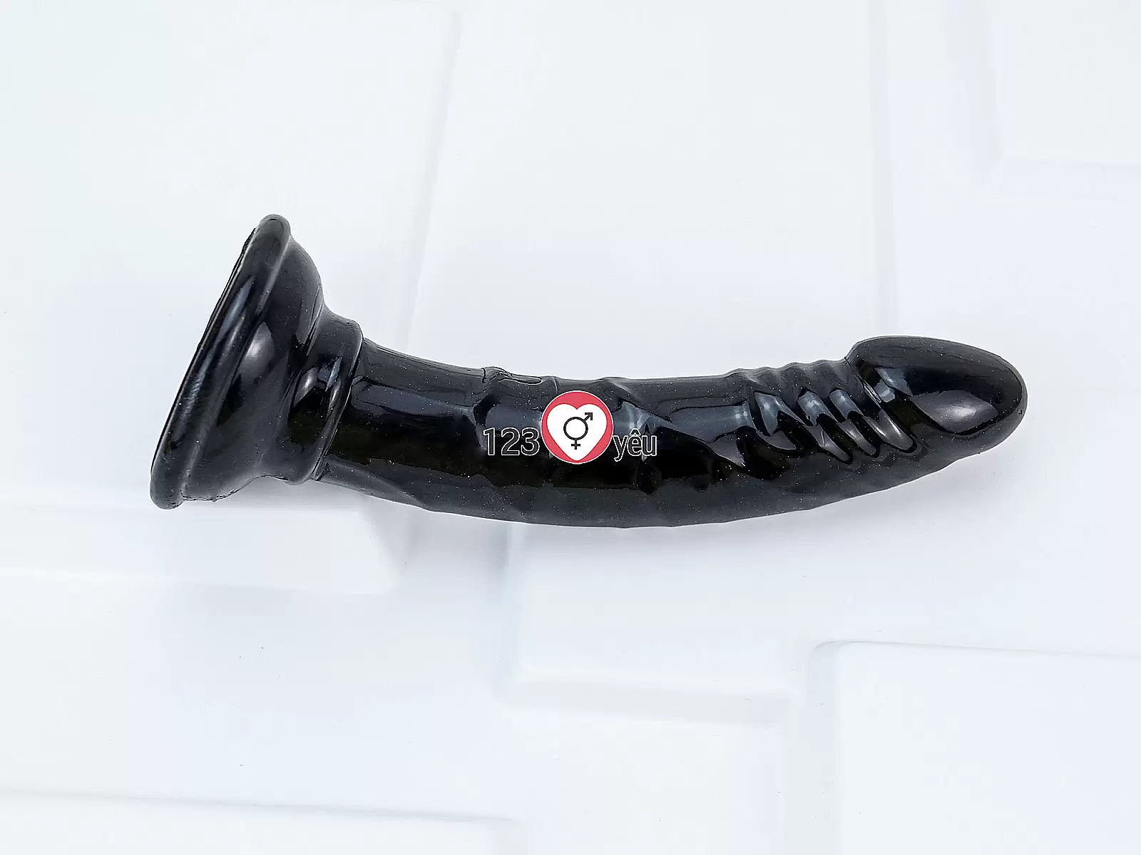 Dương vật giả có đế uốn cong silicon màu đen