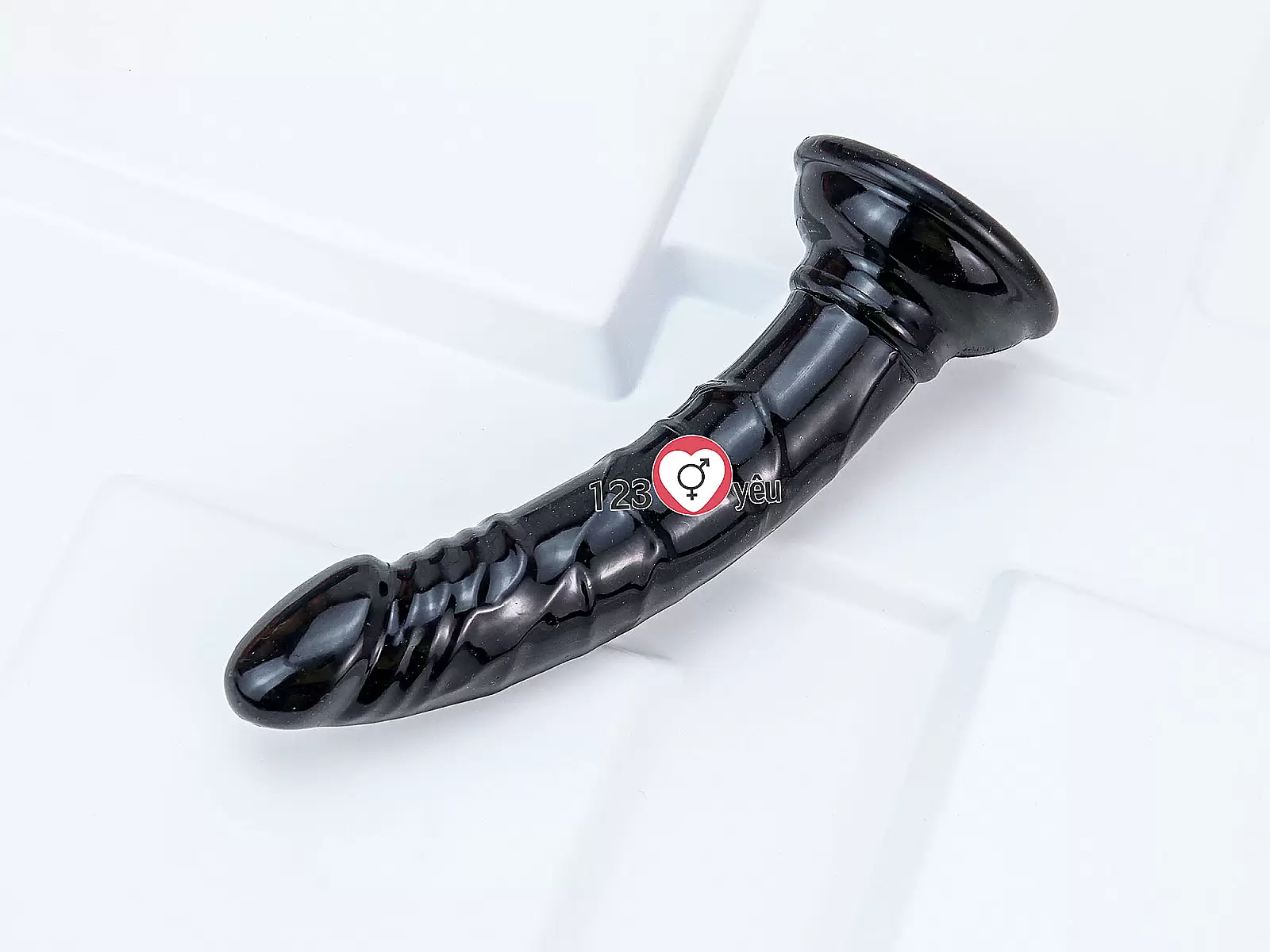 Dương vật giả có đế uốn cong silicon màu đen