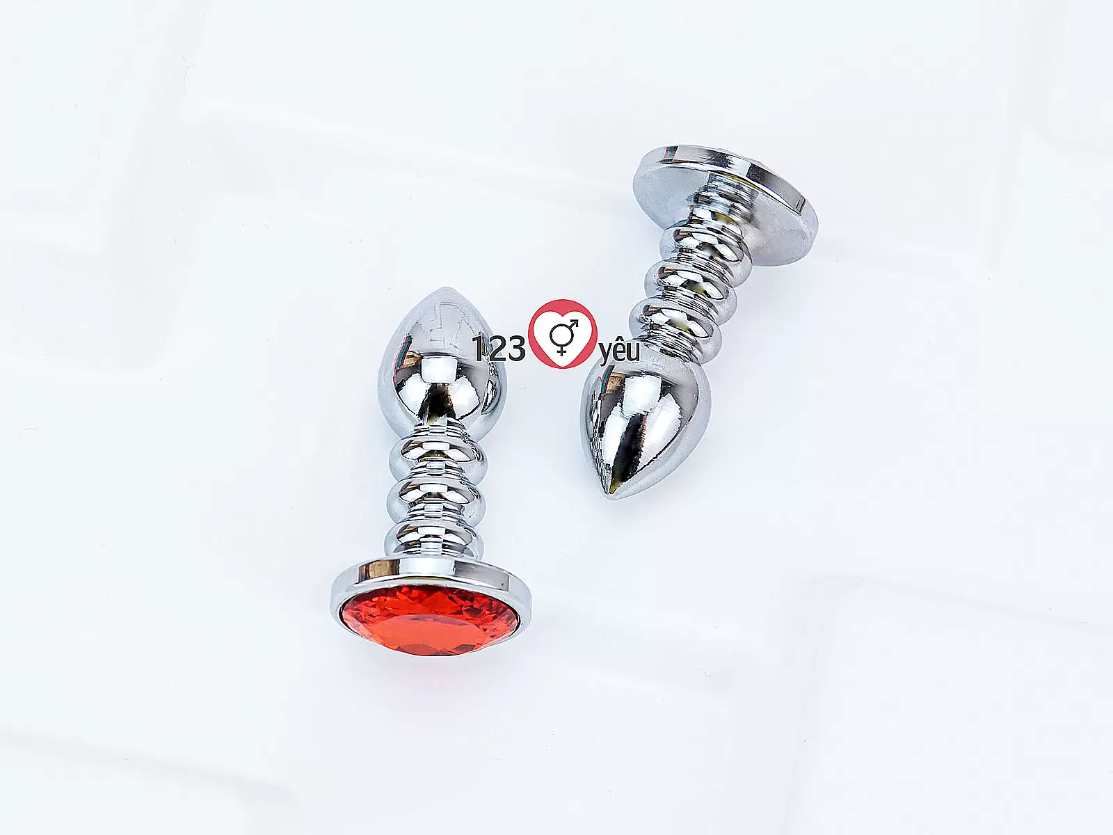 Đồ chơi kích hậu Inox xoắn ốc đuôi pha lê màu cam