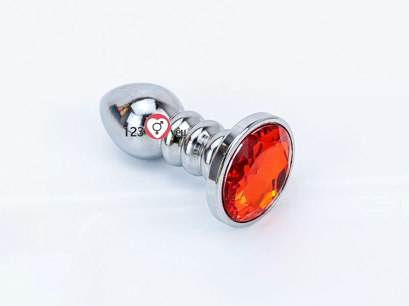 Đồ chơi kích hậu Inox xoắn ốc đuôi pha lê màu cam