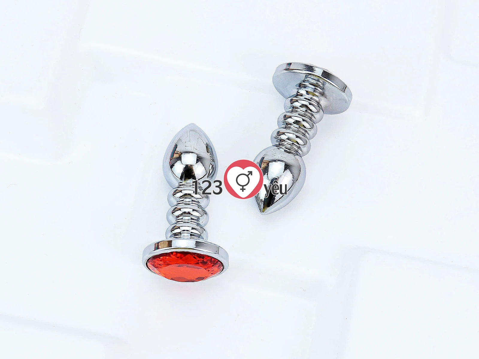 Đồ chơi kích hậu Inox xoắn ốc đuôi pha lê màu cam