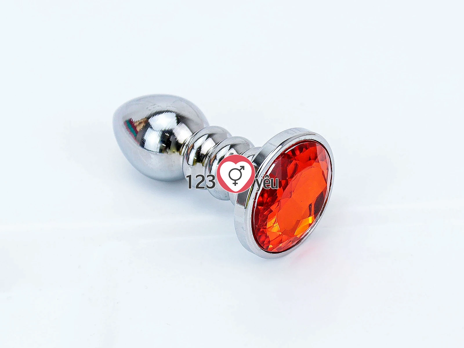 Đồ chơi kích hậu Inox xoắn ốc đuôi pha lê màu cam